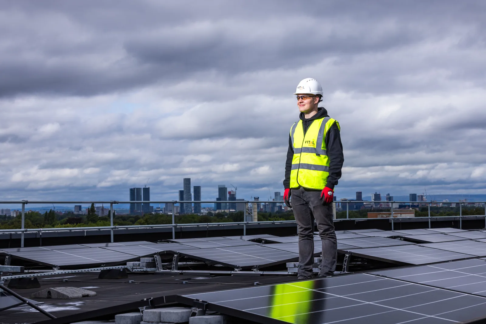 Solar engineer inspecting photovoltaic panels